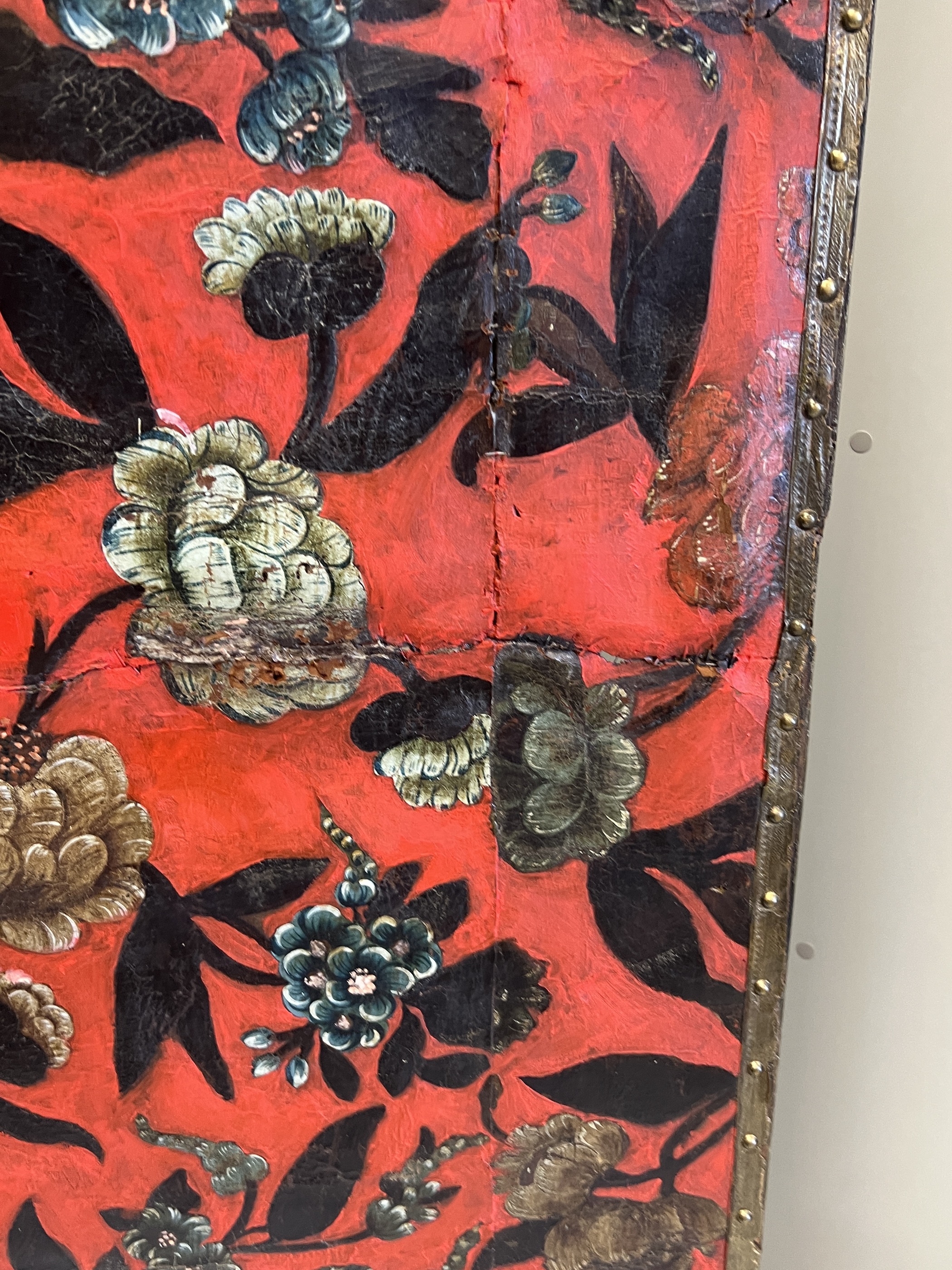 A 19th century Spanish leather three fold dressing screen re-painted by Ricardo Cinalli for the current owner, each panel width 57cm, height 175cm